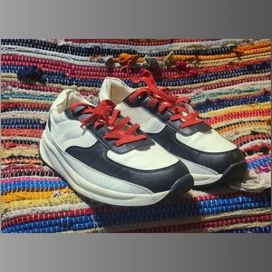 Stylish Black and White Sneakers with Red Laces